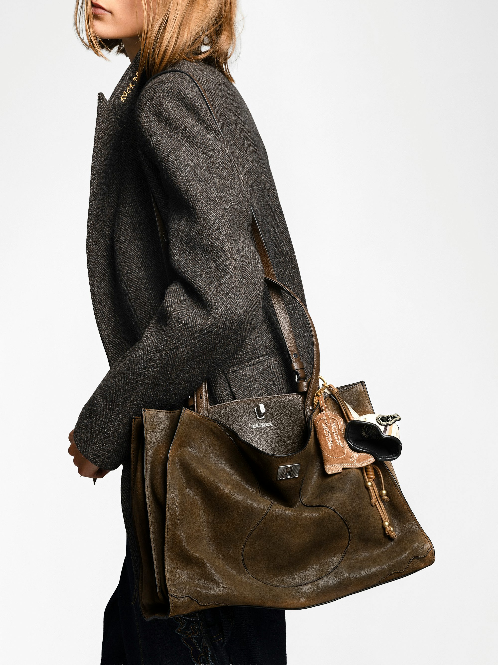 Jack Bag - Suede leather bag with signature clasp, featuring two compartments, one handle and adjustable strap.
